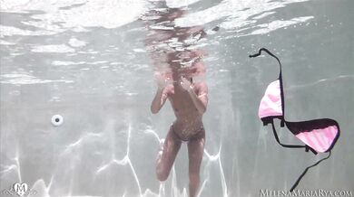 Underwater erotic fingering