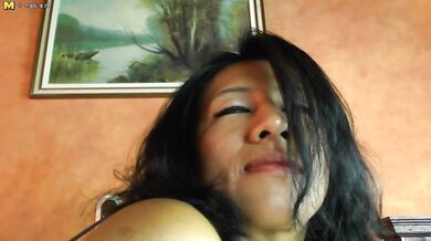 Naughty Latin Mom with large nipples playing with her pussy