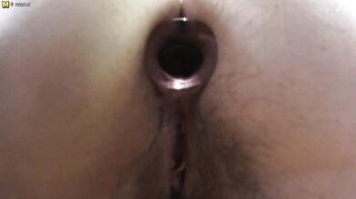 Naughty mom playing with her hairy pussy and taking a tinkle