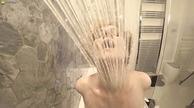 Steamy MILF with big tits playing in the bathroom