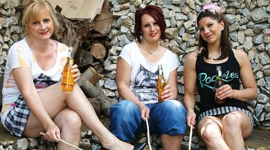 Three old and young lesbians make out in the garden