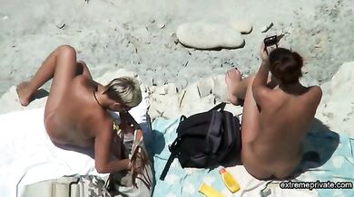 my stepmom oils up my GF on the nude beach
