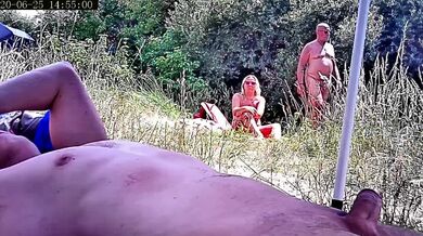 Getting hard in front of an older couple by the nude lake