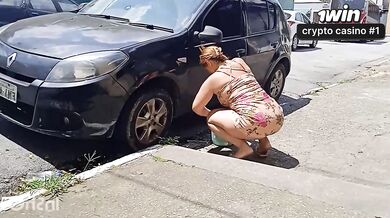 HOT GIRL WASHES HER CAR SHOWING OFF ON THE STREET