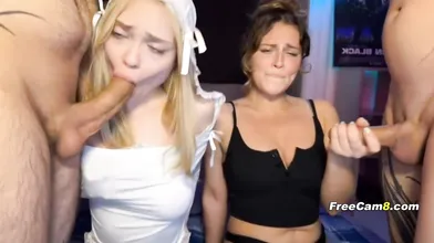 Two Slutty Babes Sucking Cock Side by Side