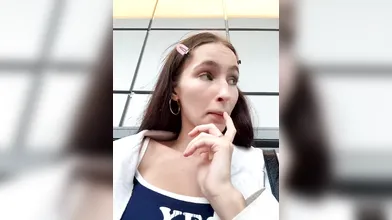 Playful Brunette Teasing with 'Yes They Are Real' Top on Public Transit & Outdoors