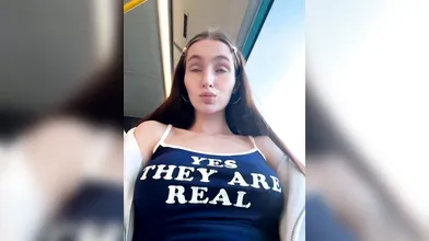 Brunette Woman Shows Natural Assets in Train Car - Yes They Are Real
