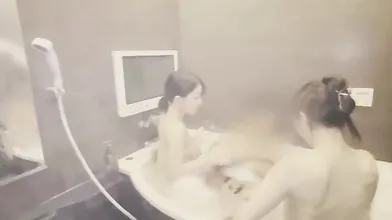 Two Asian Babes Tag Team in Steamy Session