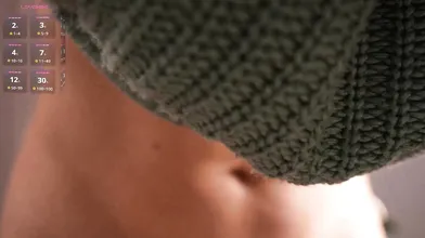 Stunning Redhead Slowly Removes Green Knitted Sweater