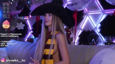 Sexy Blonde in Witch Hat at Neon Party - Cosplay Halloween Vibes