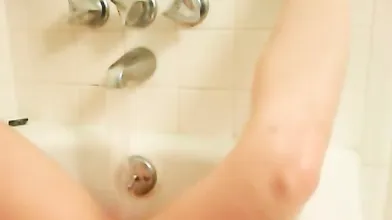 Shy girl next door masturbating in bathtub