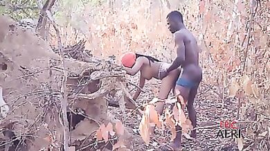 African babe is moaning while getting fucked in the nature, because it feels so good