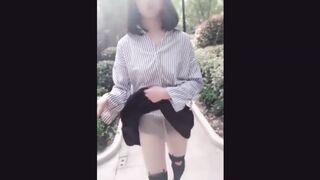 Exhibicionist Asian Ladyboy selfie stick videos flashing her cock on the street