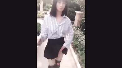 Exhibicionist Asian Ladyboy selfie stick videos flashing her cock on the street
