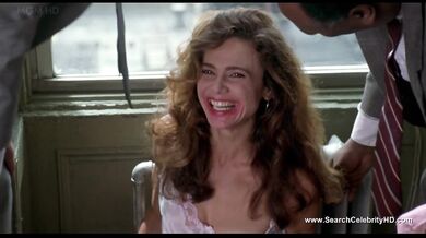 Brunette Lena Olin in lingerie shows off her small tits