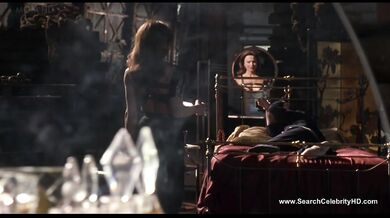 Brunette Lena Olin in lingerie shows off her small tits